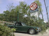 Photo of a Triumph TR6 and our sign