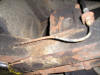A photo of Triumph rusty brake pipes