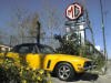 photo of a 1974 Jensen Interceptor and our sign